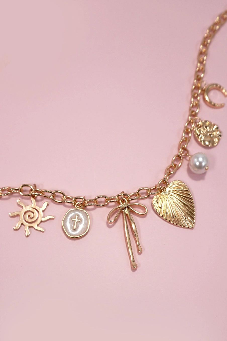 charm necklace assorted gold charms sun bow pearl cross disc charms