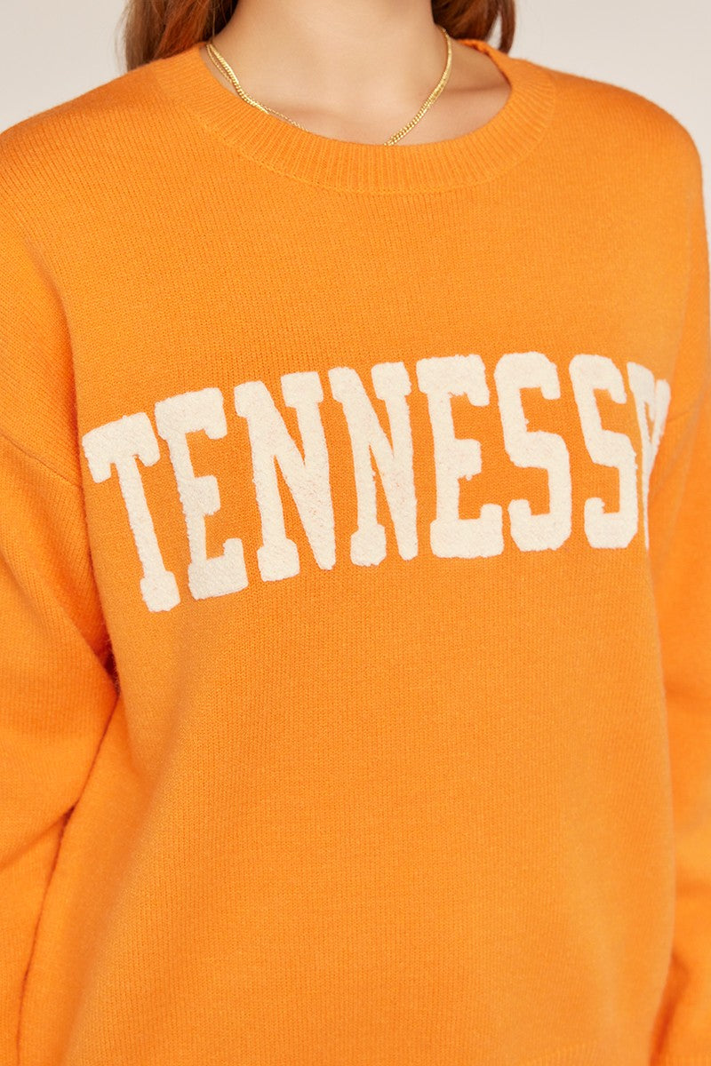 orange sweater with tennessee across the front 