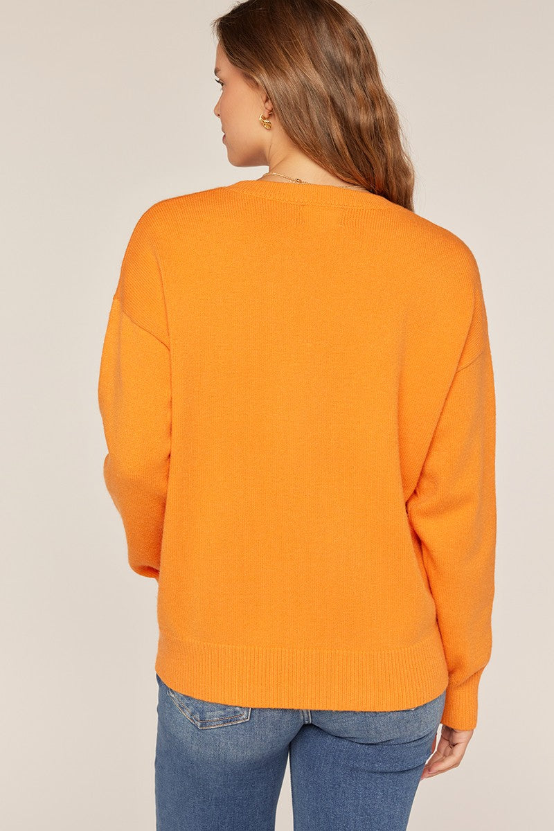 orange sweater with tennessee across the front 