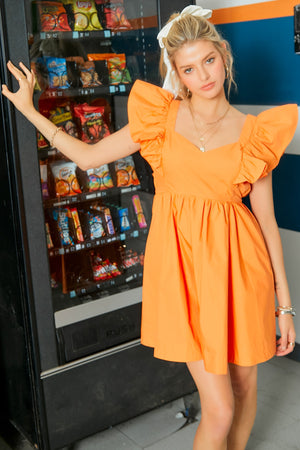 tennessee orange ruffle sleeve mini dress with tie back bow details in orange-front