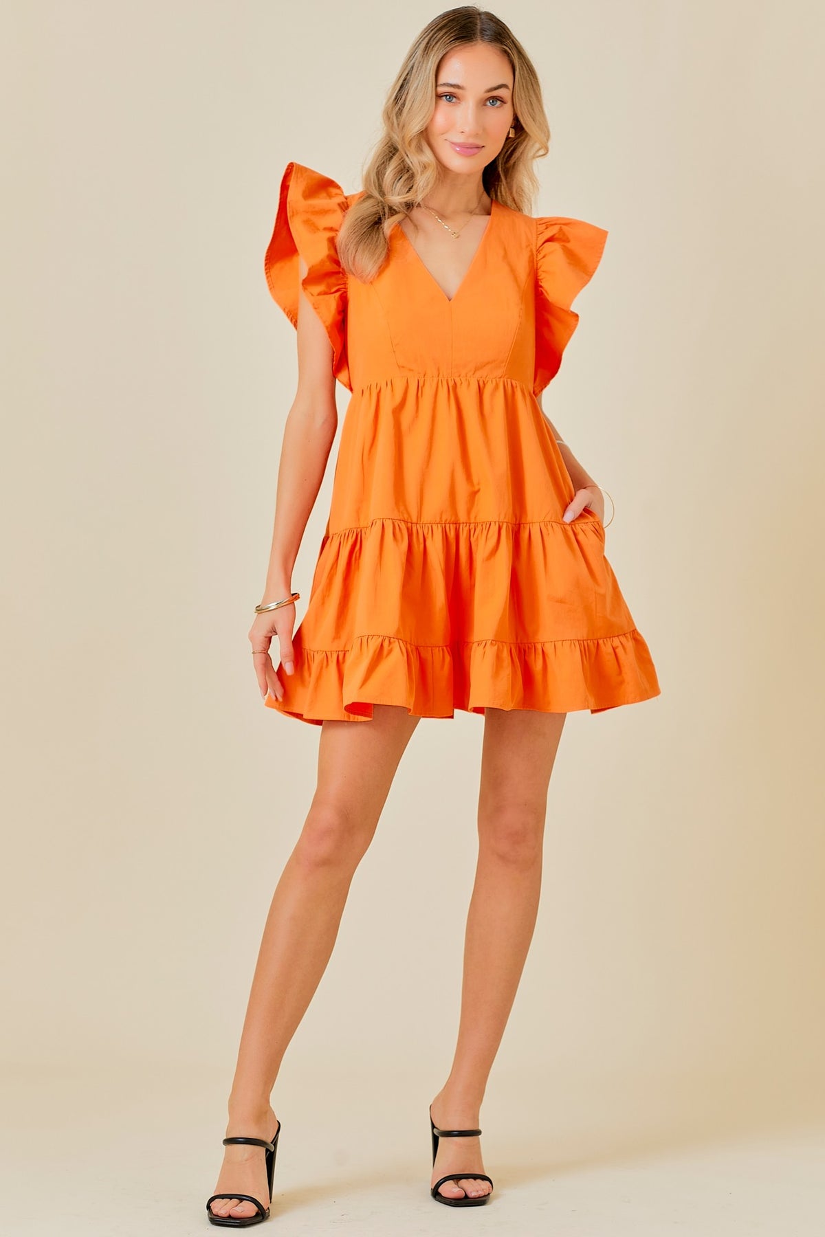 tennessee orange v neck mini dress with ruffle details-front view