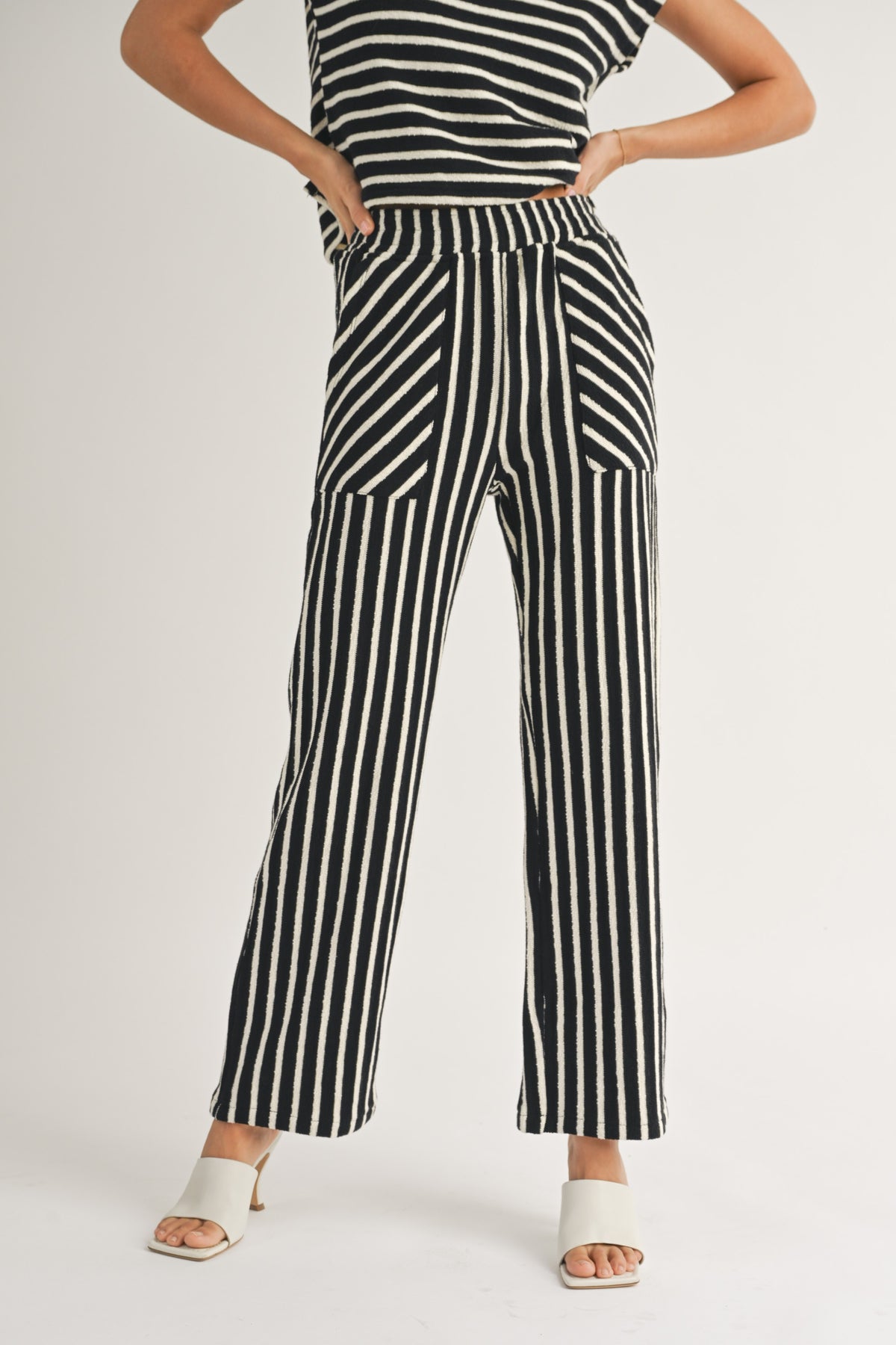 textured stripe knitted pants in black and white-front view