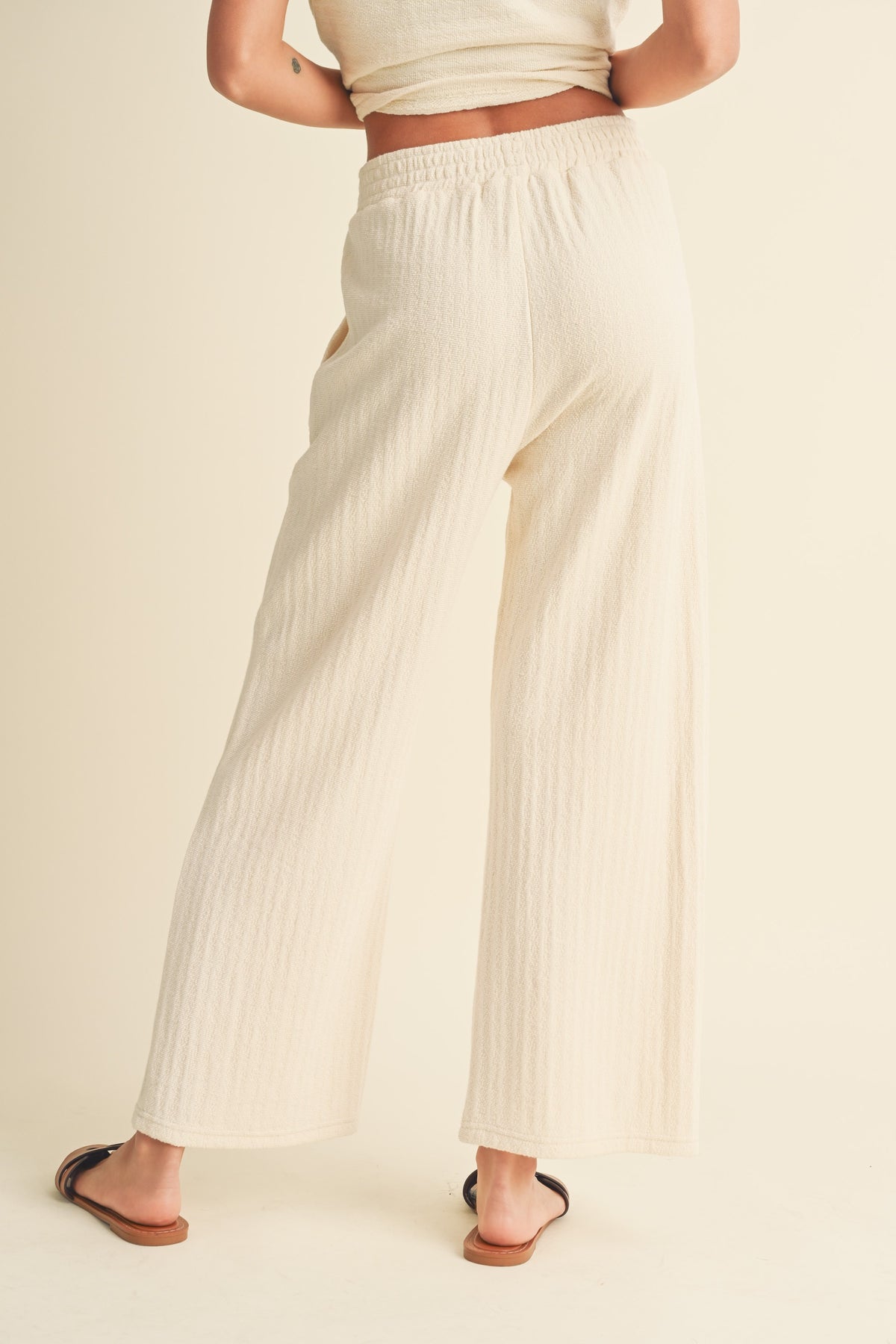 textured strip knitted pants in cream-back