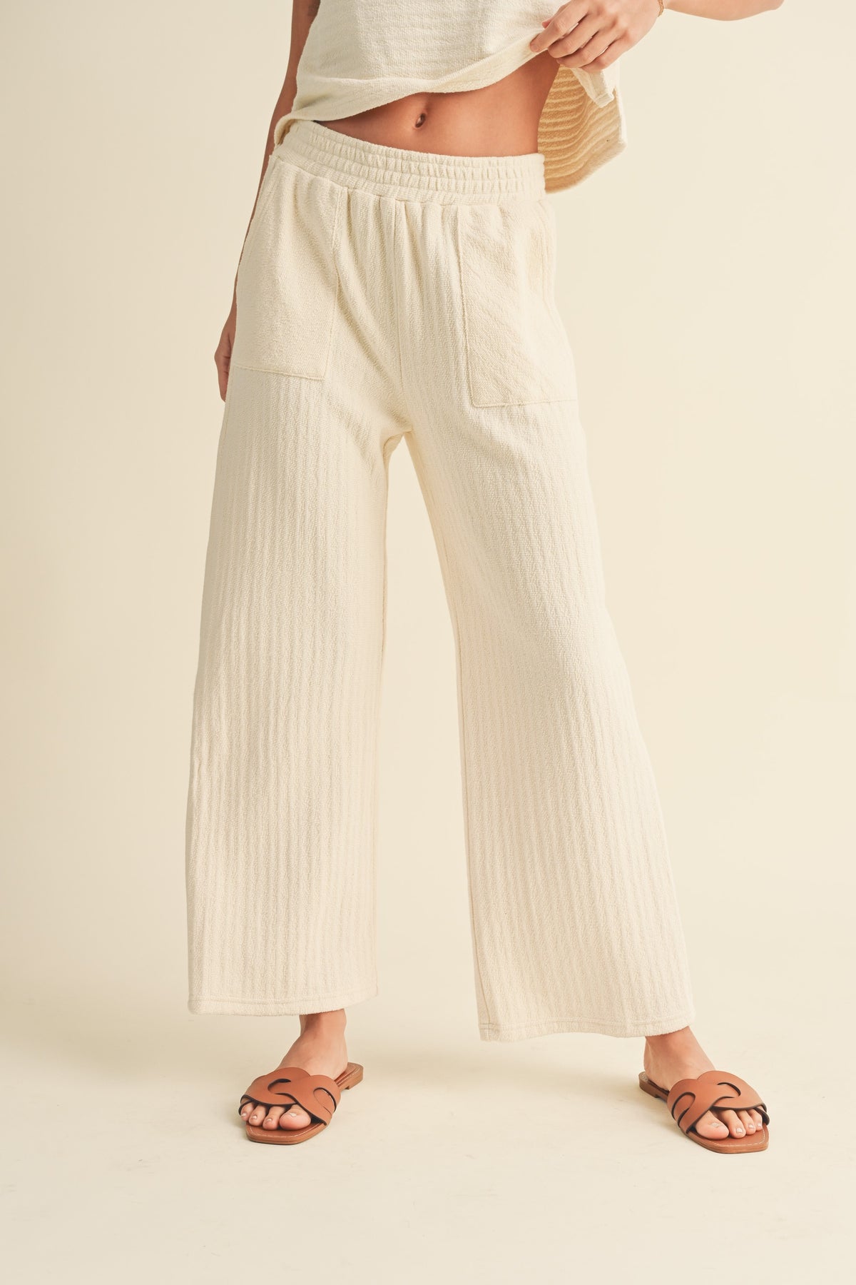 textured strip knitted pants in cream-front
