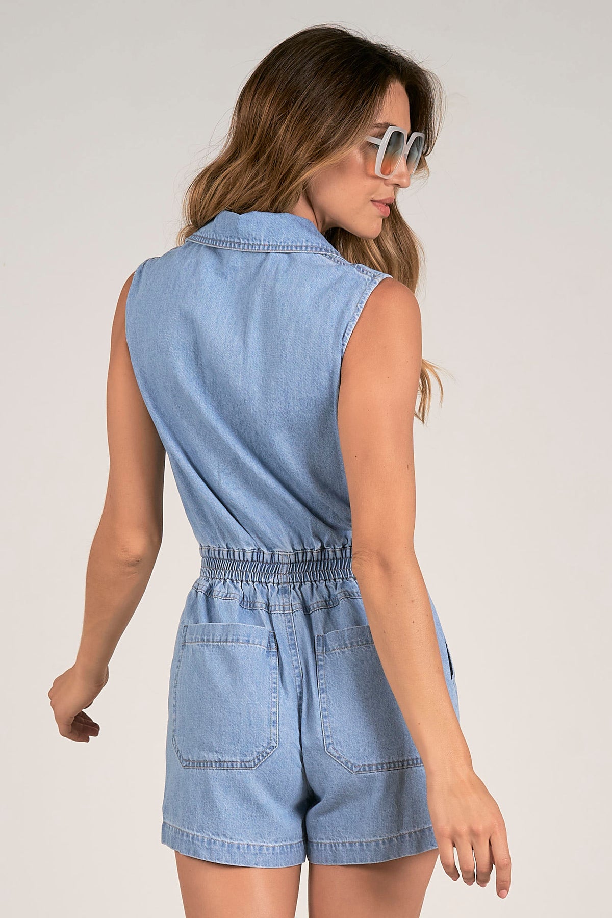 elan molly zip romper in light denim-back