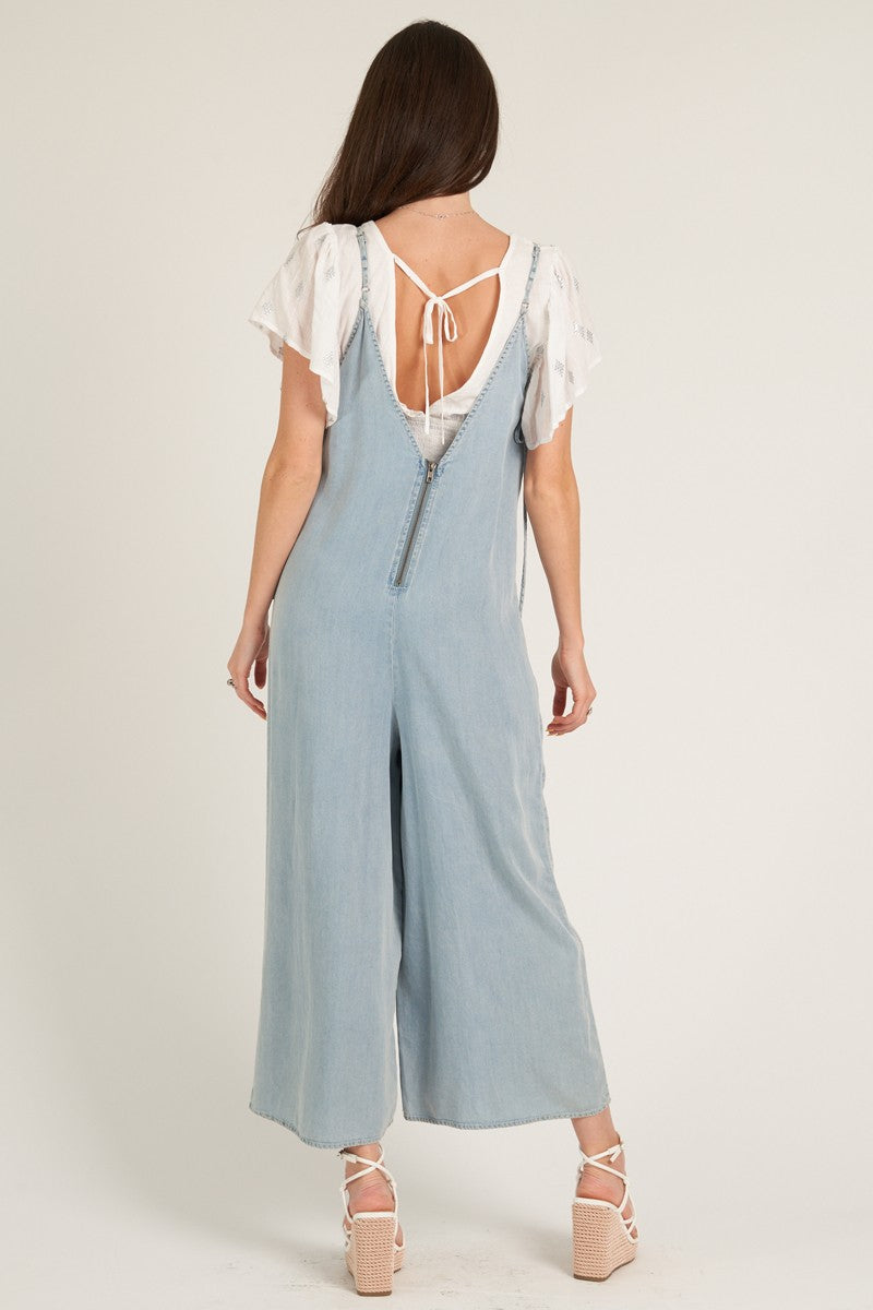 wide leg denim jumpsuit in light wash denim-back view