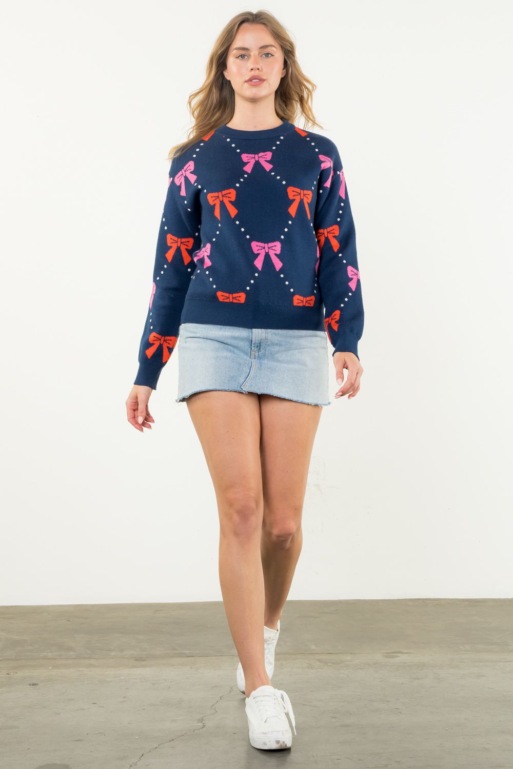 Ribbon Knit Sweater in navy featuring pink and red bows-front