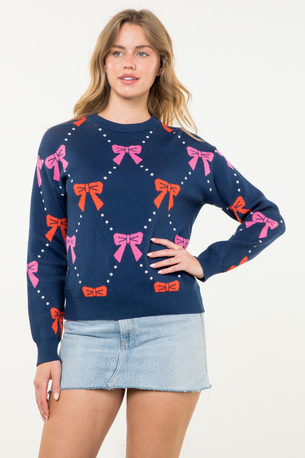 Ribbon Knit Sweater in navy featuring pink and red bows-front