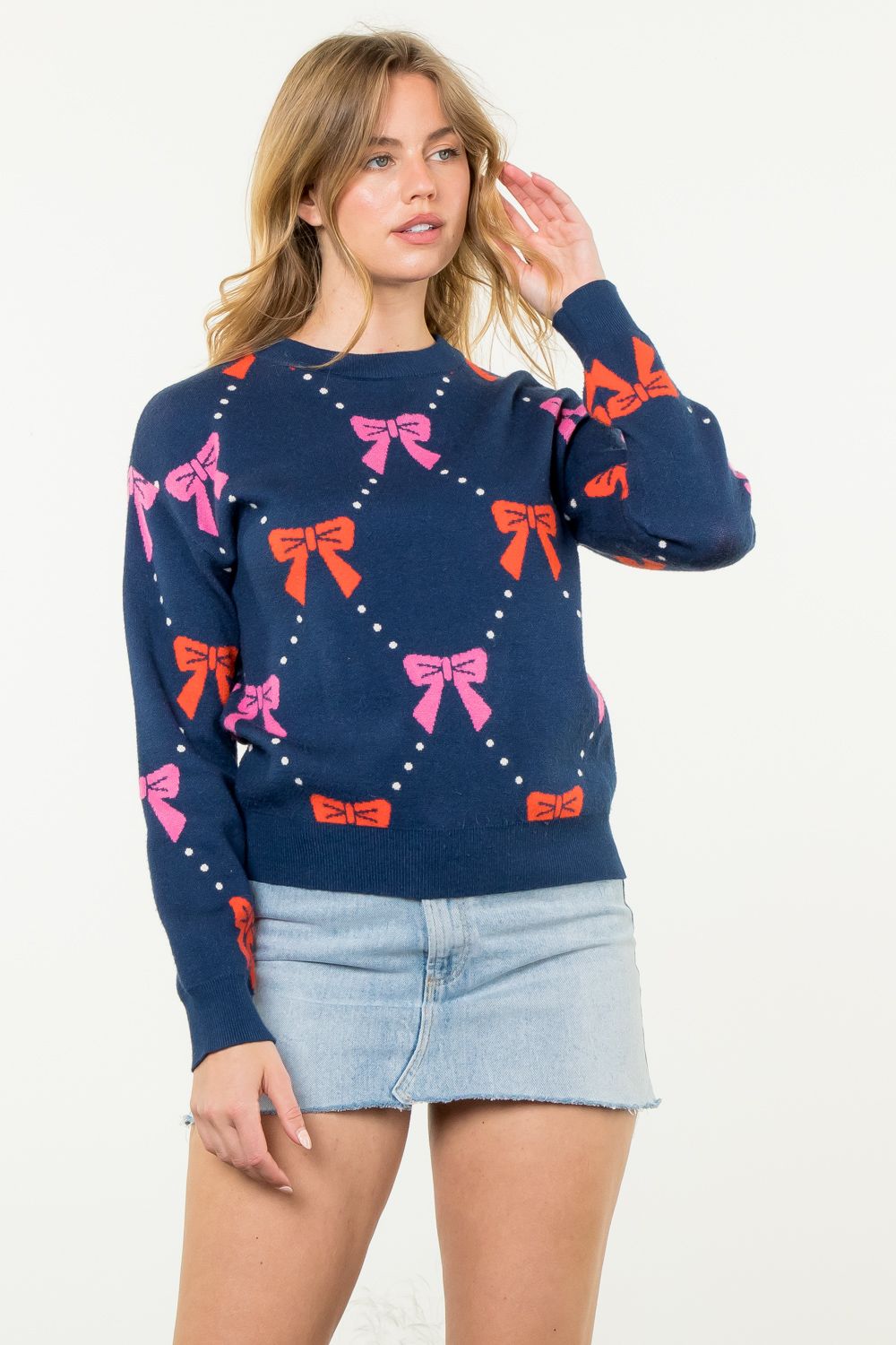 Ribbon Knit Sweater in navy featuring pink and red bows-front