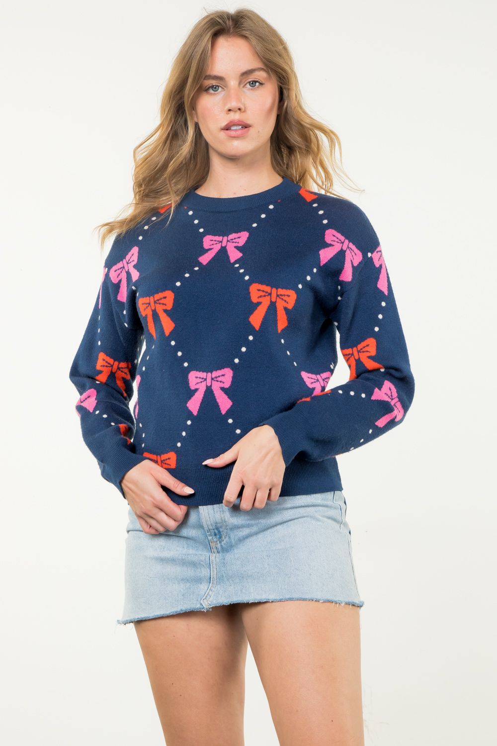 Ribbon Knit Sweater in navy featuring pink and red bows-front